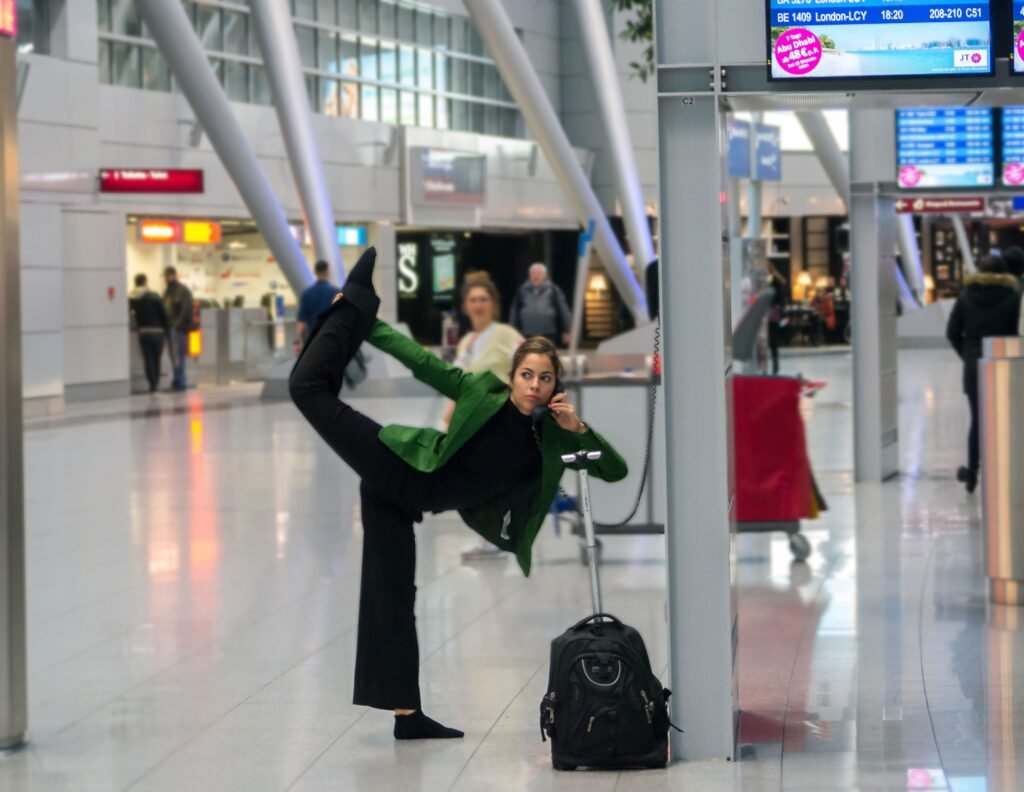 Carmen Mar Lymphie Warrior Dance Pose in airport terminal Duesseldorf NRW Germany