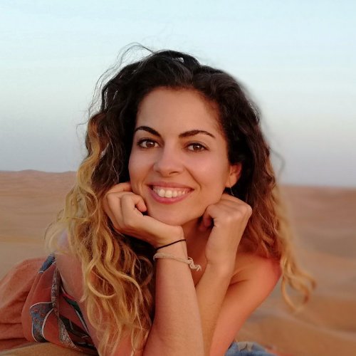 Carmen Mar face portrait in red desert dunes close up